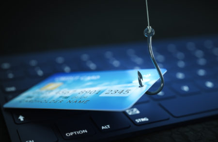 phishing credit card data with keyboard and hook symbol